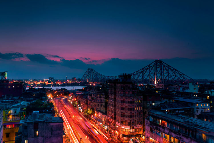 High angle view of illuminated city at dusk