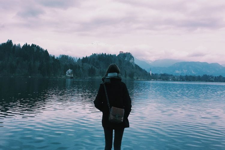 Scenic view of lake against cloudy sky