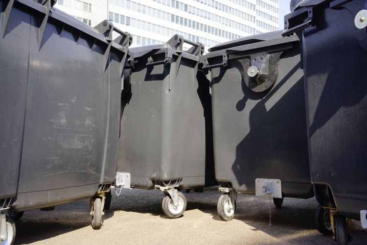 Low angle view of garbage bin in city