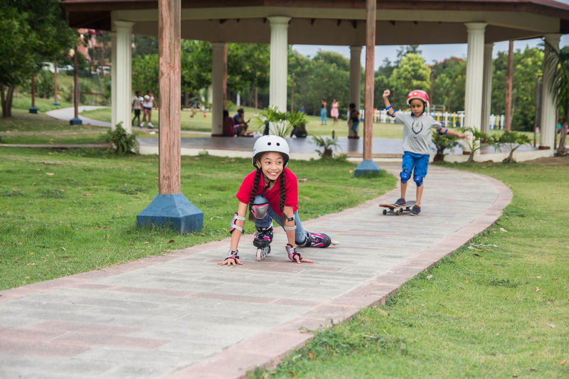 Full length of children playing in park