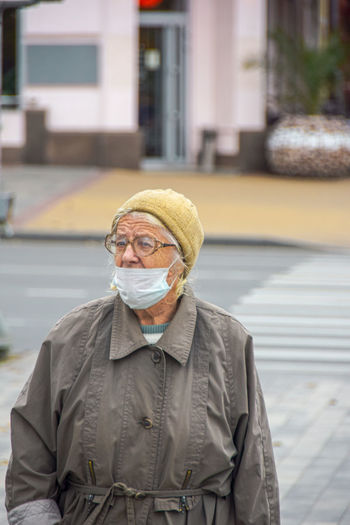 Portrait of man standing on street