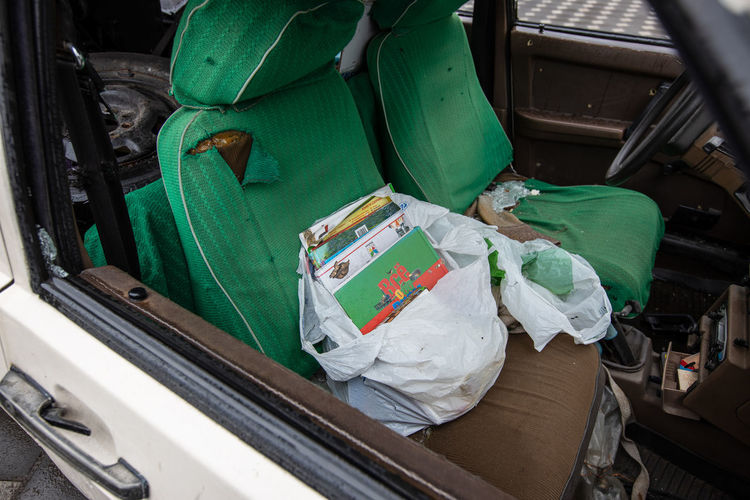 Children's books and things in the car. the owners wanted to escape from military, the invaders.