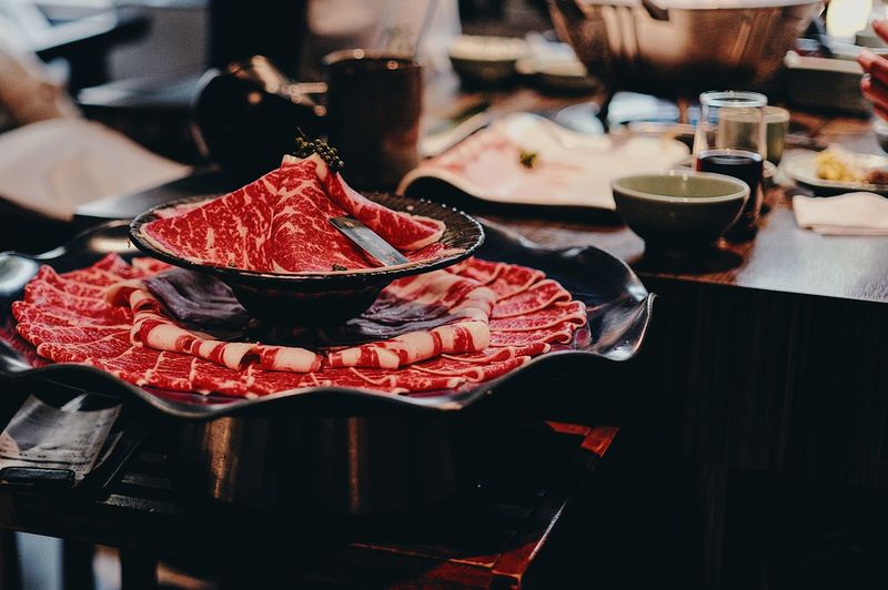 Close-up of sliced meat on table
