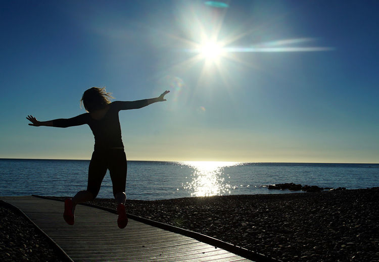 Sun shining over sea
