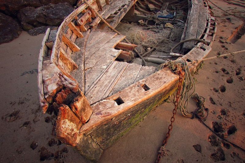 High angle view of abandoned boat on sand