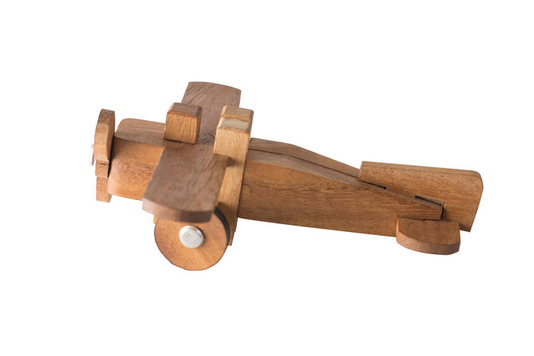 Close-up of old wooden structure against white background
