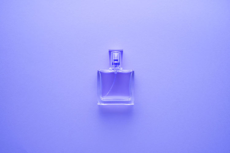 Close-up of bottle against blue background