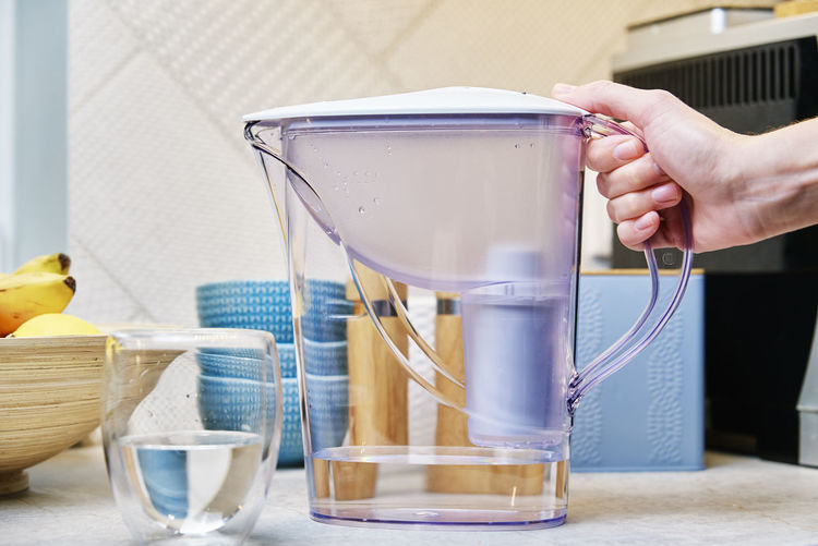 Glass of water and water cleaning filter