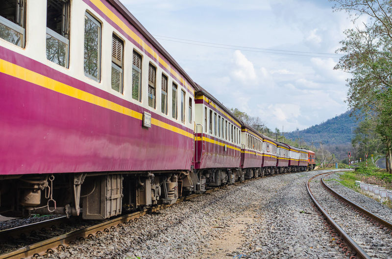 Train on railroad tracks against sky