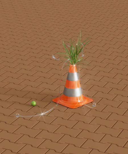 Surreal urban summer environment. composition with traffic cone and grass. city life. 