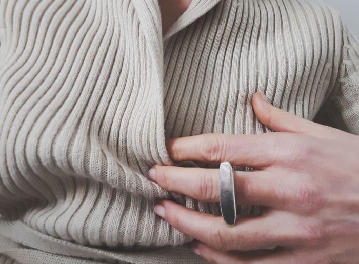 Midsection of woman wearing ring