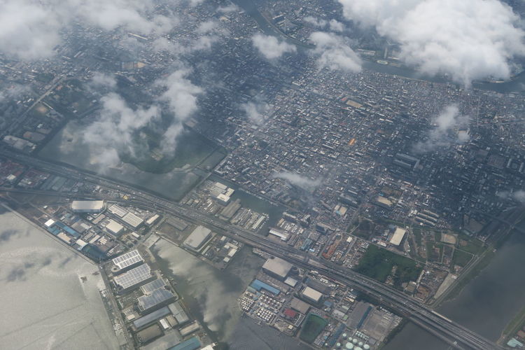 High angle view of city buildings seen through window