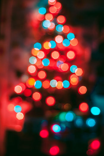 Defocused image of illuminated christmas tree