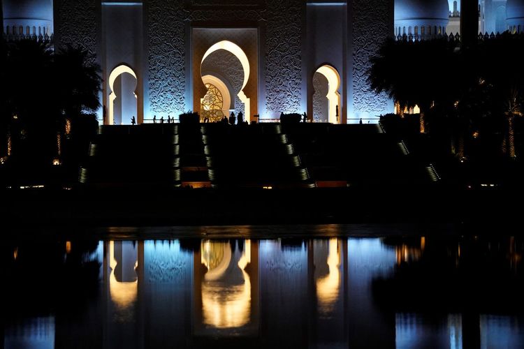 Night view on illuminated marble domes of grand mosque