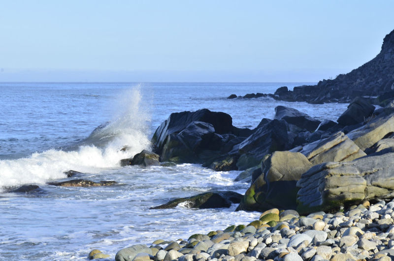 Pacific ocean waves splash,and spray against the rocks on the coast of baja california sur, mexico