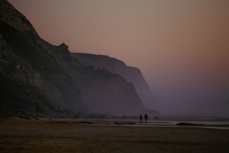 Scenic view of landscape against sky during sunset