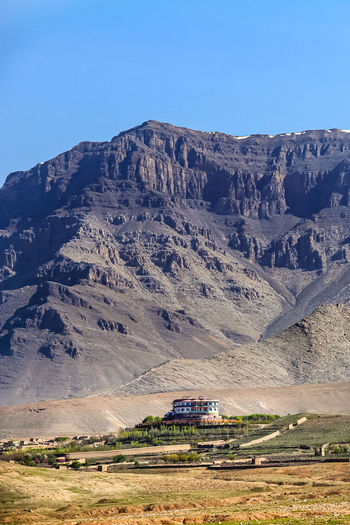 A large house and a mountain in the background. a large house near kabul, afghanistan. detached. 