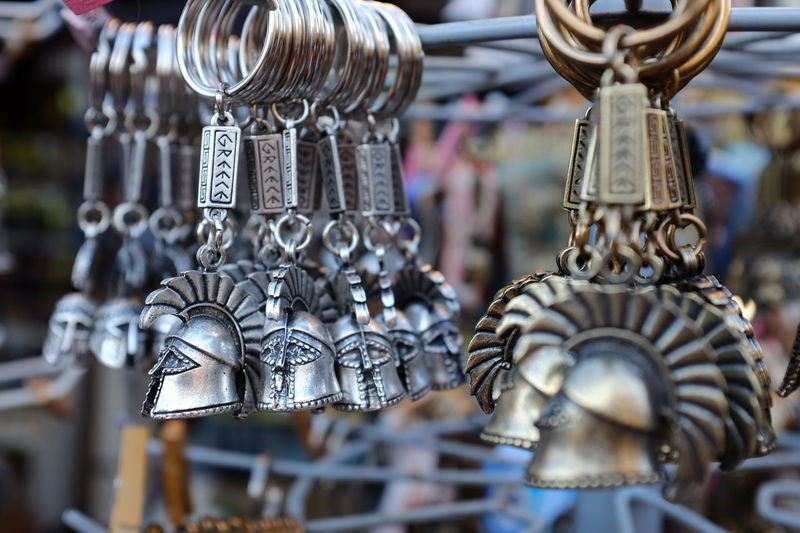 Armor helmet key rings for sale at market stall