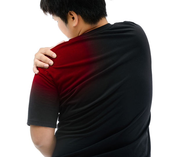 Rear view of man standing against white background