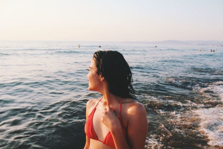 EyeEm Selects sun sets right into the ocean here Sea Real People Lifestyles One Person Water Beach Beauty In Nature Nature Horizon Over Water Bikini Young Women Outdoors Young Adult Day Women Scenics (null) Travel Summer Vacation Sunset Vacations Sommergefühle Fresh On Market 2017