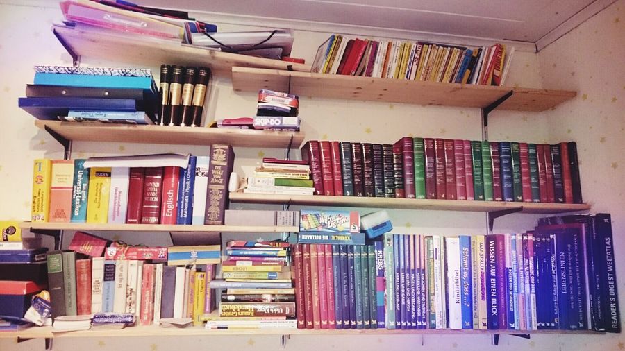 Books arranged in shelf
