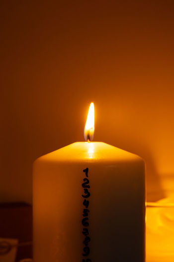 Candle with advent calendar traditional burning christmas wax candles with numbers counting down for