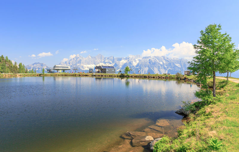 Scenic view of lake against blue sky