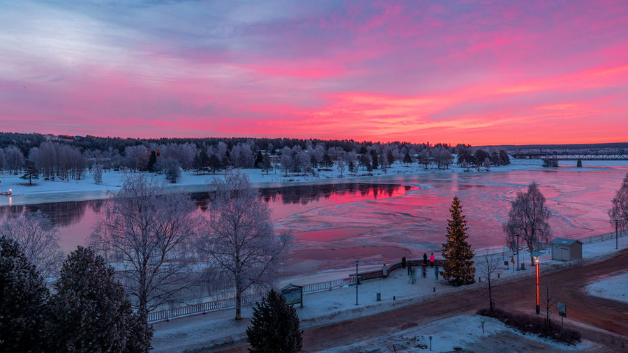 Scenic view of lake against sky during sunset