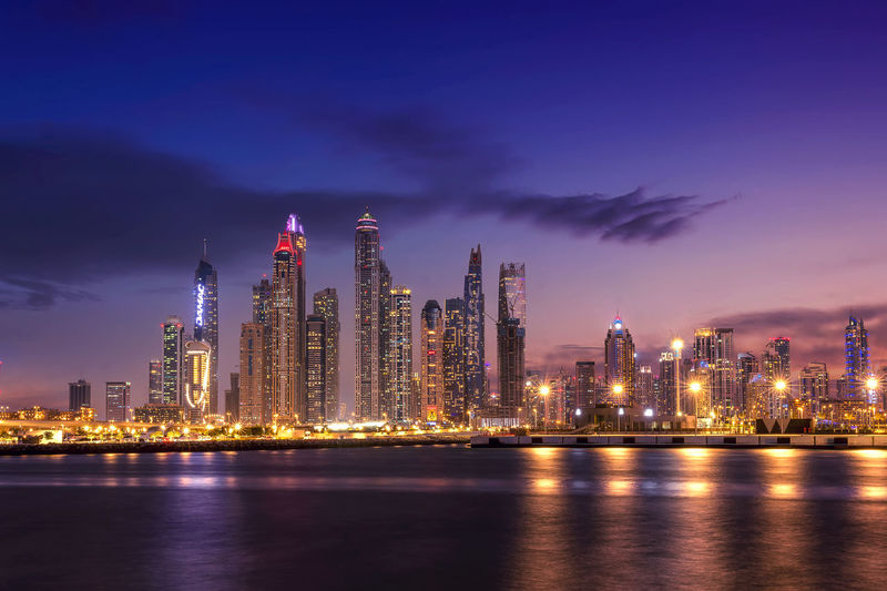 Sunset view of dubai marina and famous jumeirah beach skyline emirates
