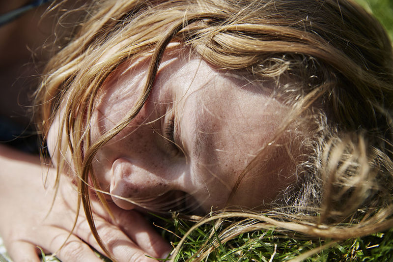 Girl sleeping on grass