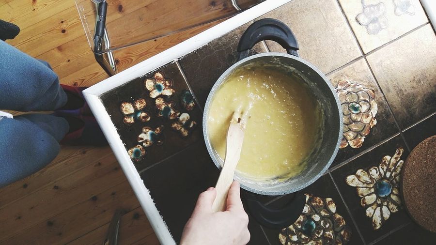 High angle view of mixing dough