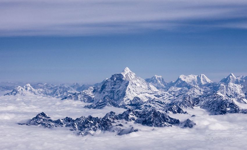 Scenic view of snowcapped ama dablam mountains against cloudy sky
