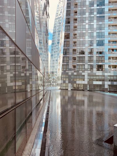 Modern buildings in city seen through glass window