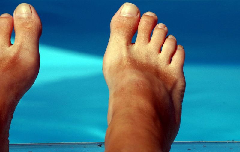 Low section of person at swimming pool
