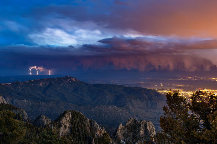 Scenic view of mountains against sky at sunset