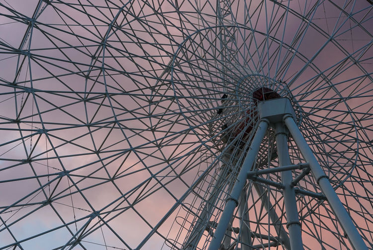 Low angle view of ferris wheel against the sky
