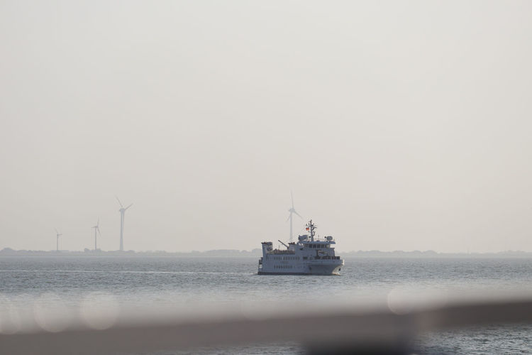 Ferry as passanger ship on its way through the wadden sea to a island in friesland