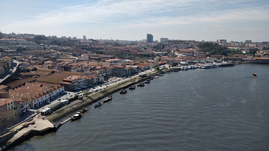 Aerial view of town by river against sky - porto