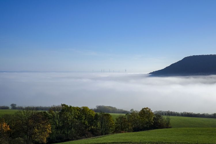 Scenic view of field against sky on a foggy morning in the eichsfeld