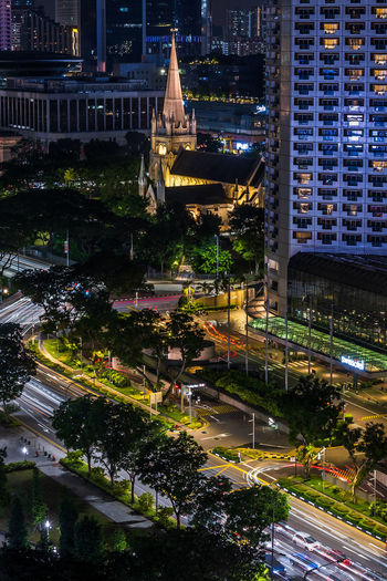 High angle view of illuminated buildings in city at night