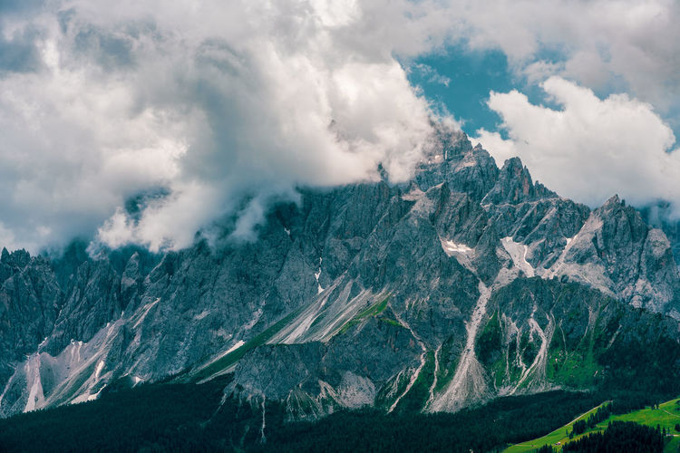 Storm clouds over the sexten dolomites, italy.