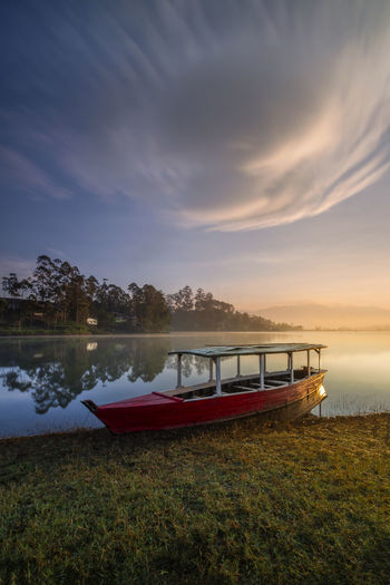 The boat rests with a beautiful view in a good weather, blue sky white clouds and sun shining bright