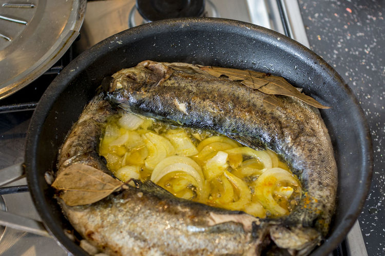 Close-up of fish in skillet