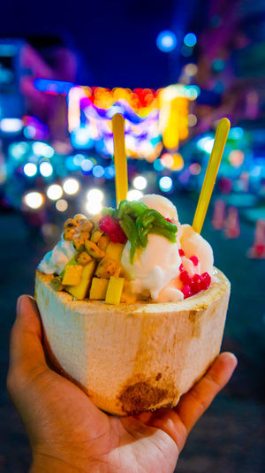 Close-up of hand holding ice cream