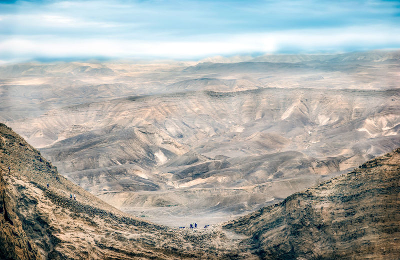 Aerial view of mountain range against sky