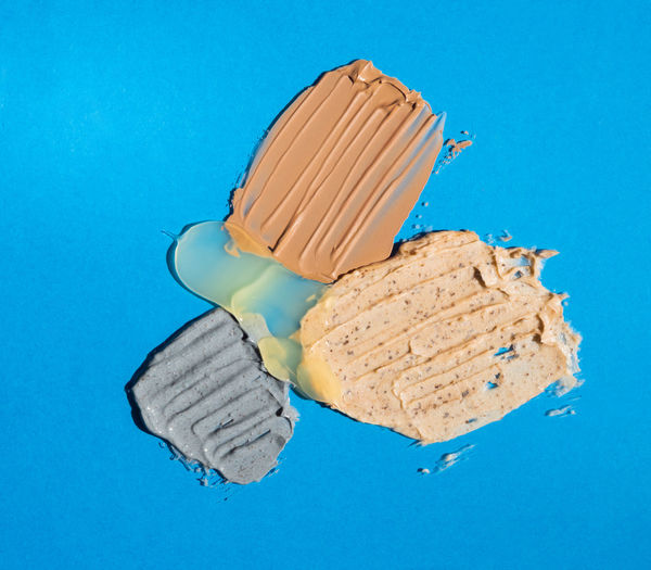 High angle view of dentures against blue background