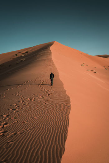 Scenic view of desert against clear sky
