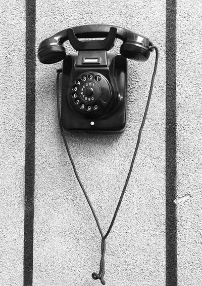 High angle view of old-fashioned telephone on table