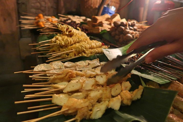 Midsection of person preparing food