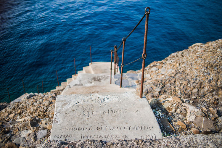 High angle view of steps against sea